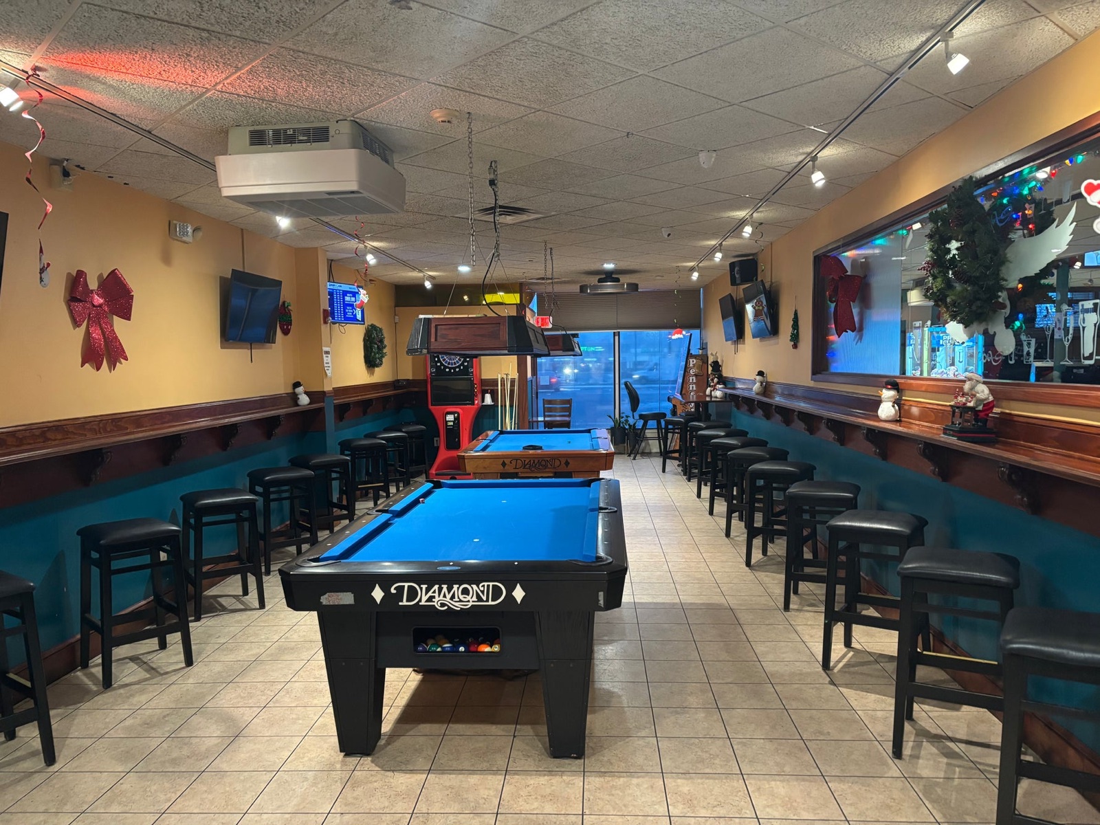 Pike's Pub back pool room — Diamond table, dartboard, booth seating